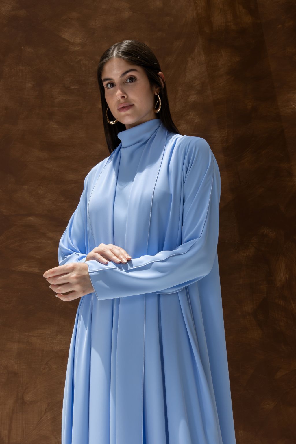 Selected Lines light blue abaya as a classic evening dress for special occasions with long sleeves and high neckline