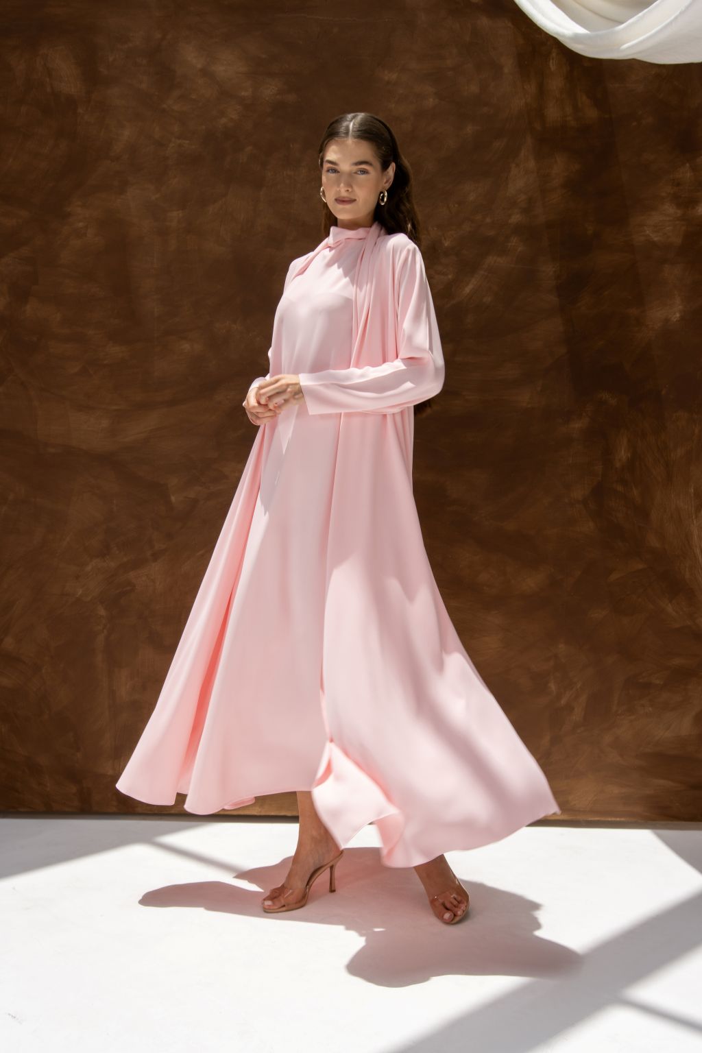 Pink Selected Lines abaya flowing dress styled as a classic evening dress for special occasions