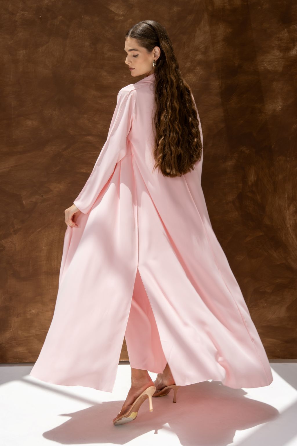 Selected Lines pink abaya styled as a classic evening dress for special occasions with long flowing design