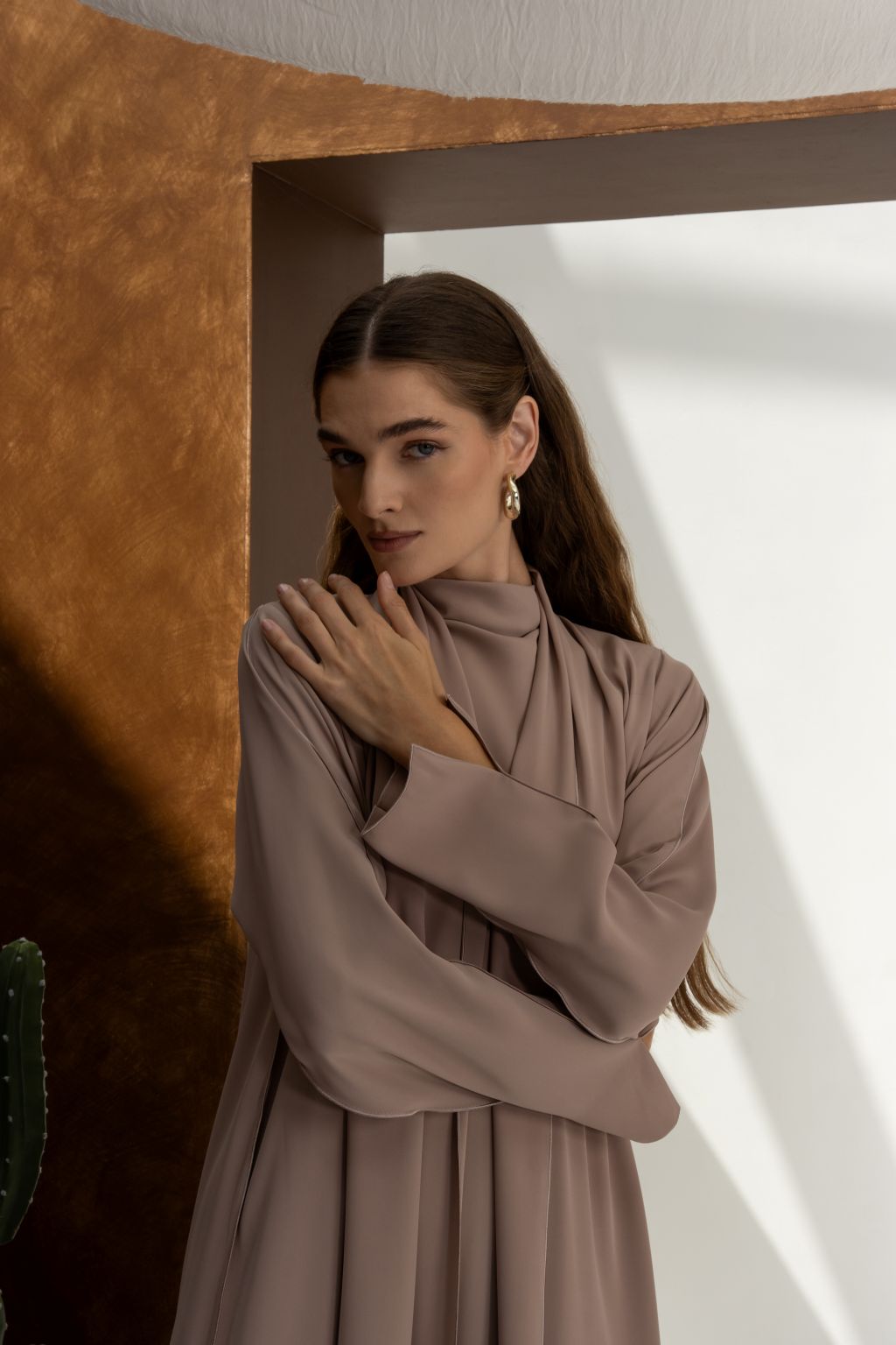 Selected Lines abaya in soft taupe color worn by woman classic evening dress for special occasions