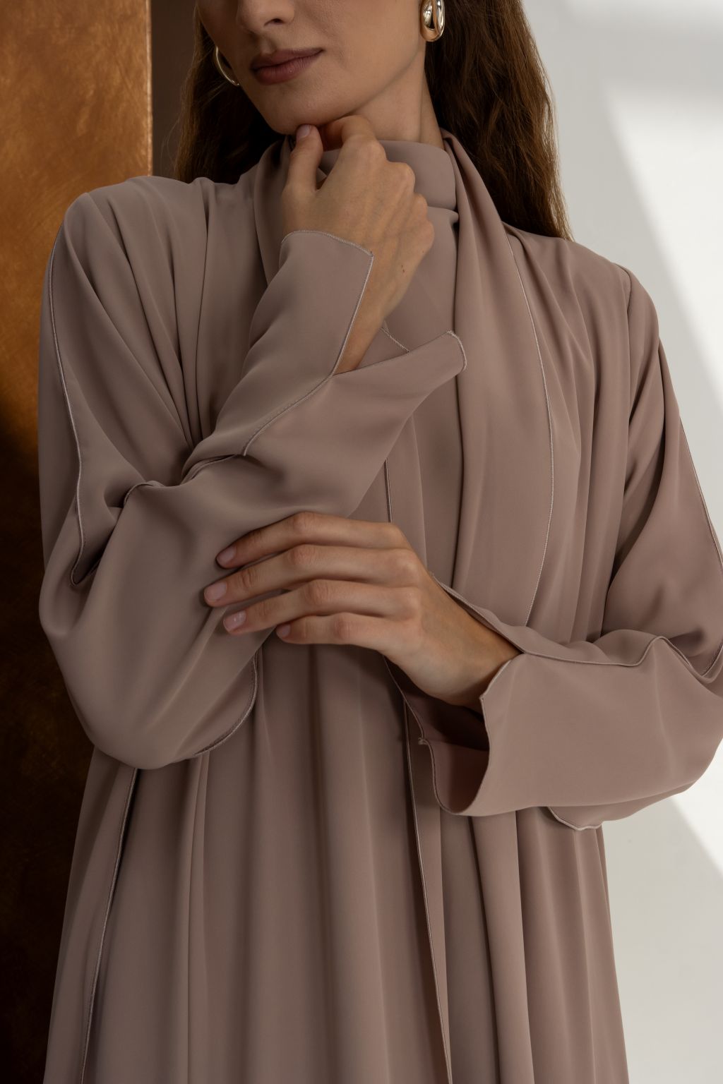 Selected Lines taupe abaya as a classic evening dress for special occasions with elegant draped design