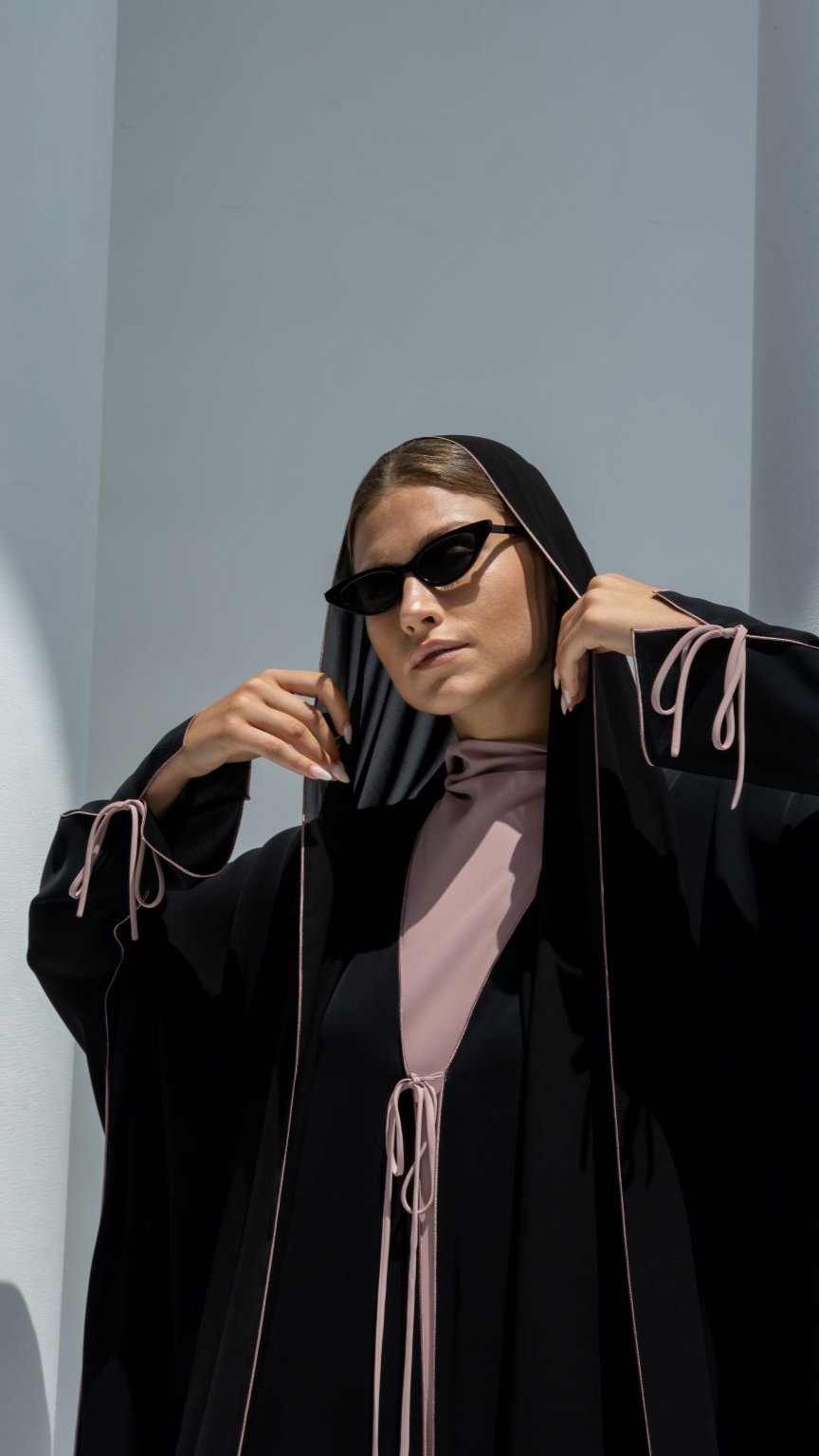 Stylish Bahraini ribbon abaya in black with elegant detailing and matching headscarf