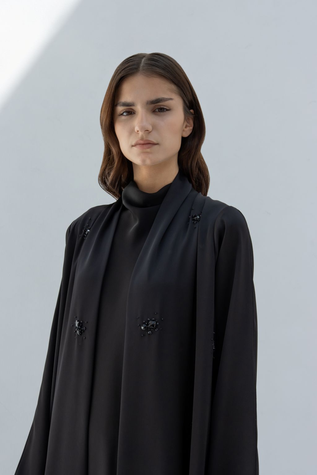 Selected Lines black formal abaya for women with subtle embellishments and a modest high neckline