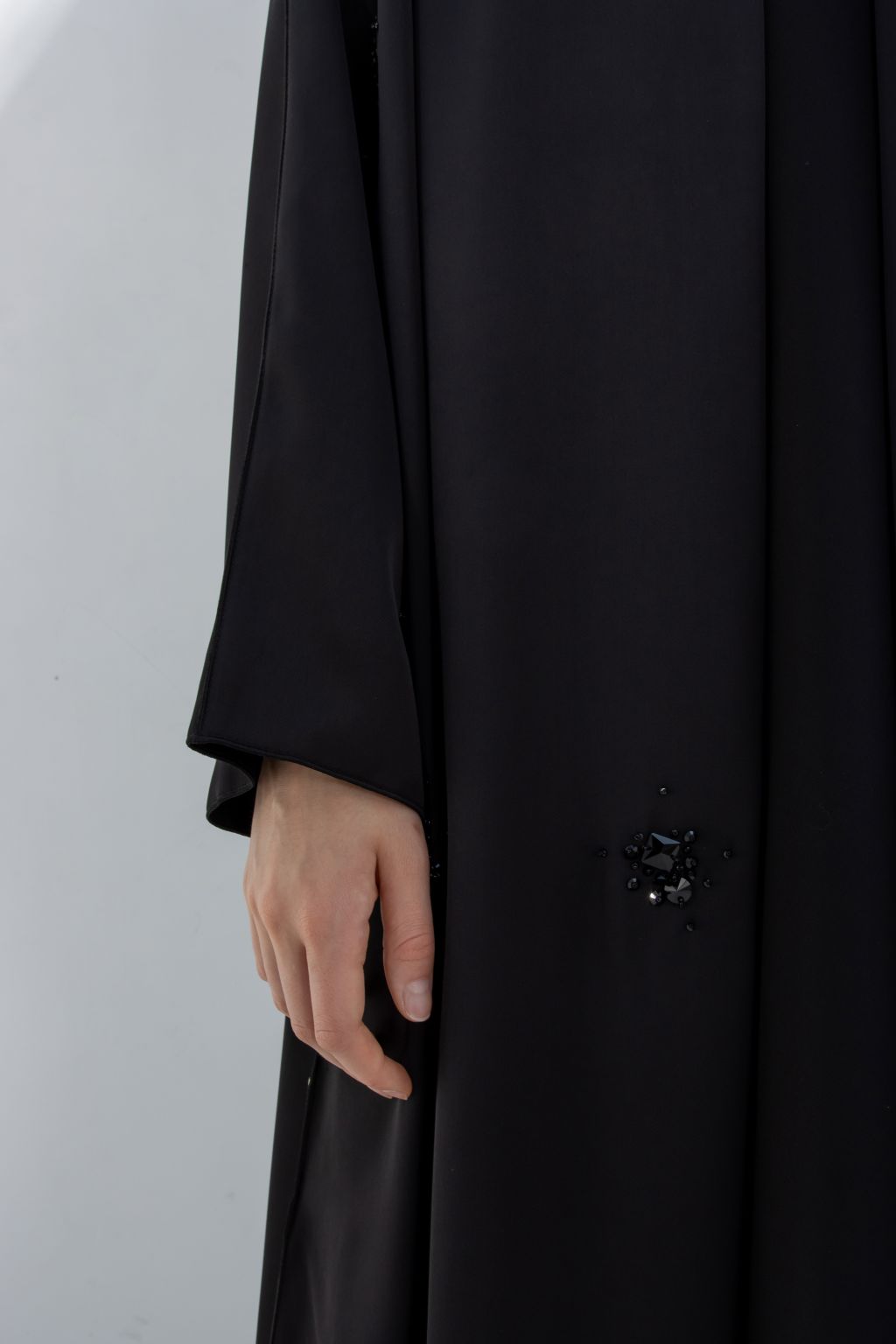 Selected Lines black formal abaya for women with subtle bead embellishment on sleeve cuff