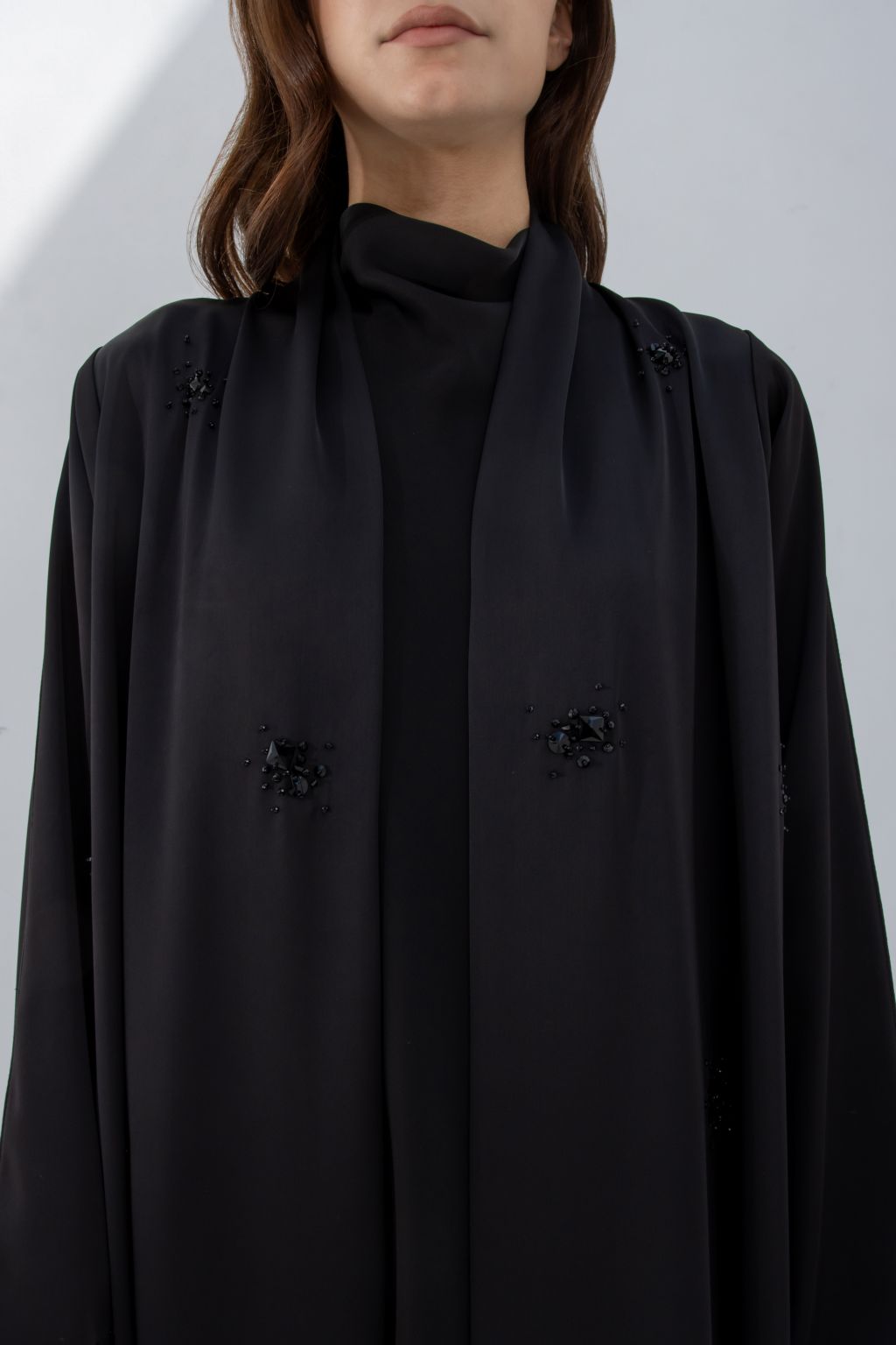 Selected Lines black formal abaya for women with subtle embroidered details and flowing fabric