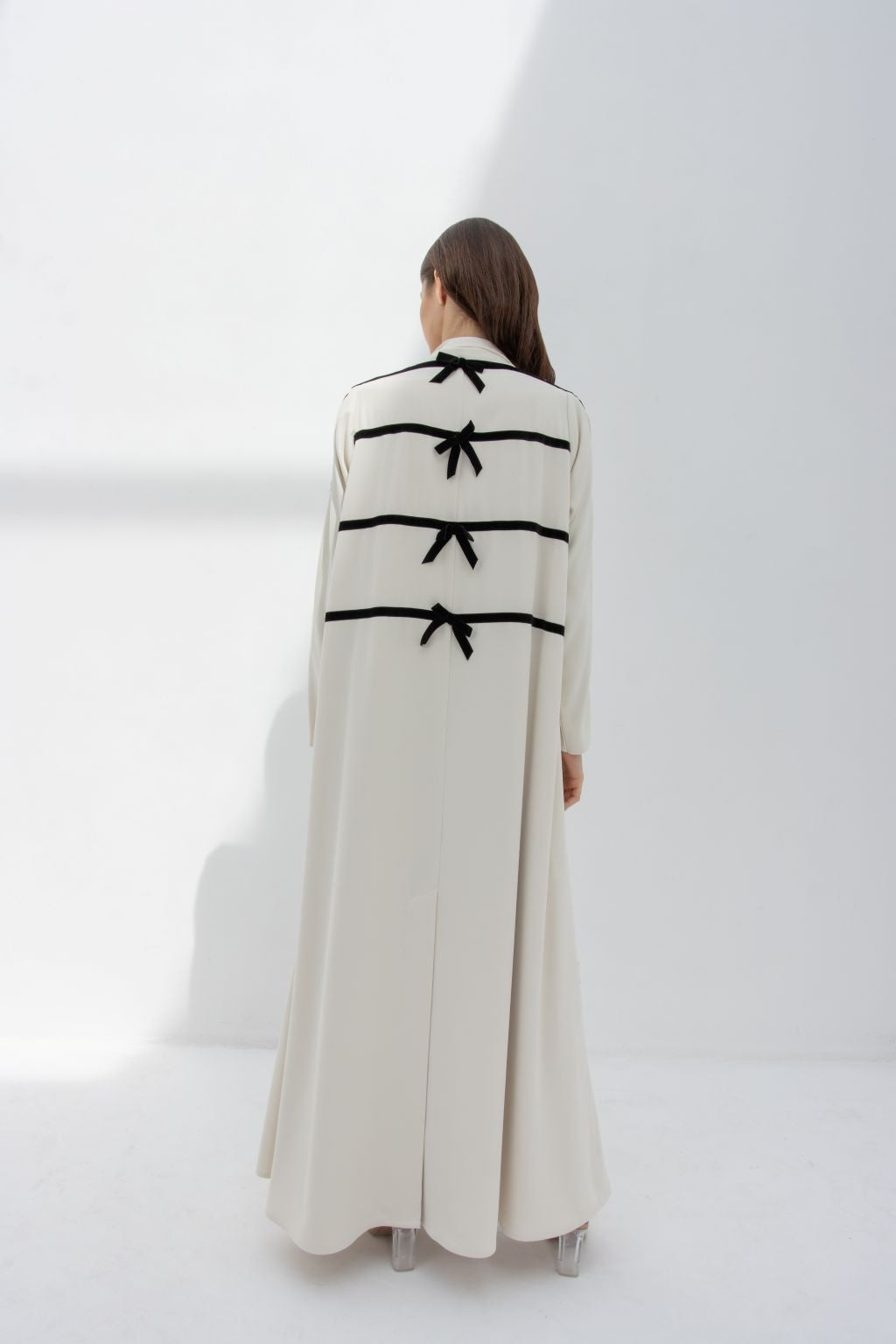 Elegant abaya featuring black velvet ribbon for sewing detailing on the back for a stylish look