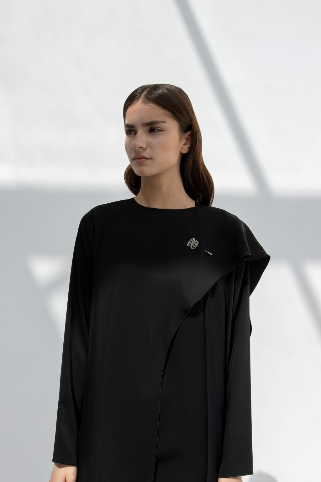 Selected Lines elegant flip wing abaya in black with long sleeves and draped design