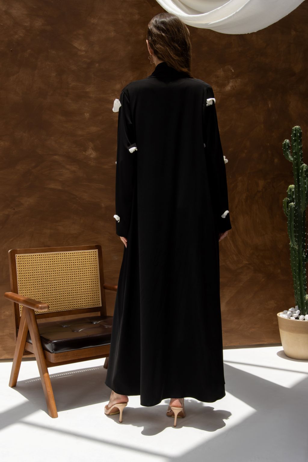 Selected Lines black designer abaya handcrafted details with white accents on sleeves and back