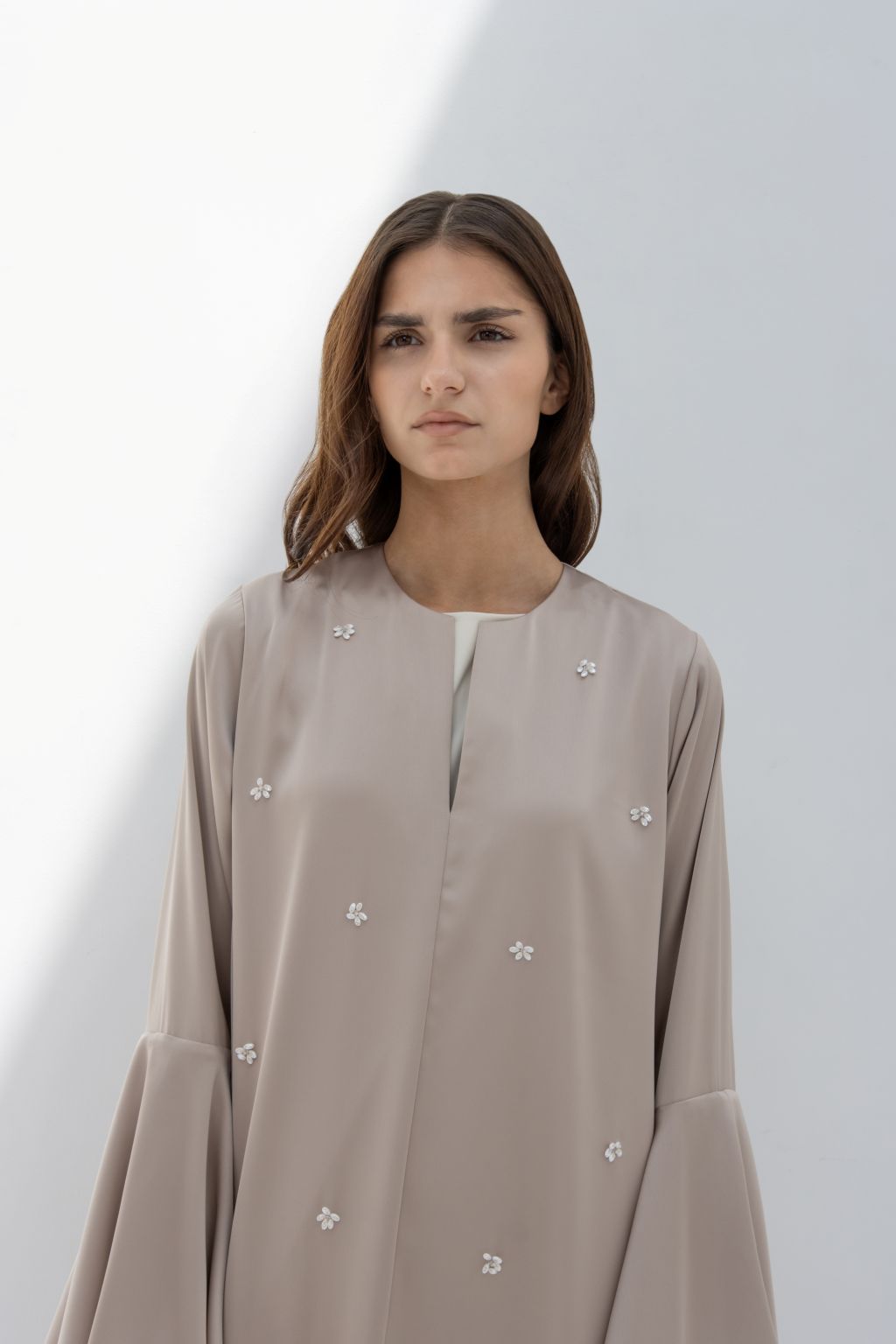 Selected Lines elegant seashell dress in beige with subtle floral embellishments and long sleeves