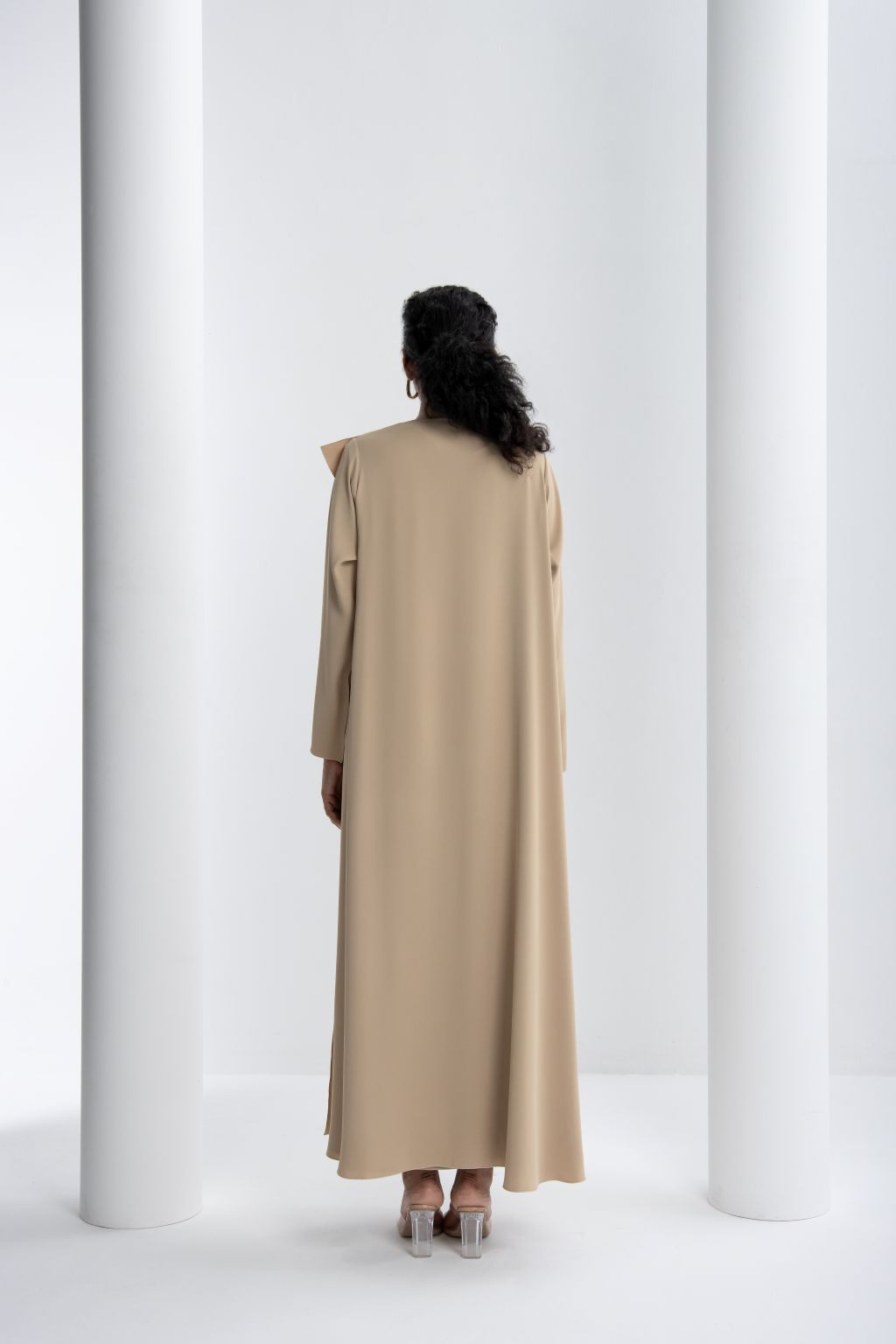 Elegant abaya for women in beige featuring a stylish back design and flowing fabric