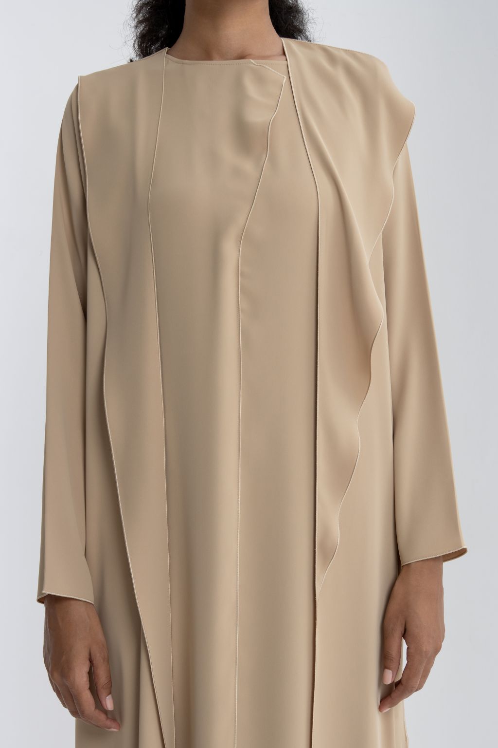 Elegant abaya for women in soft beige with stylish draped detail for a modern look