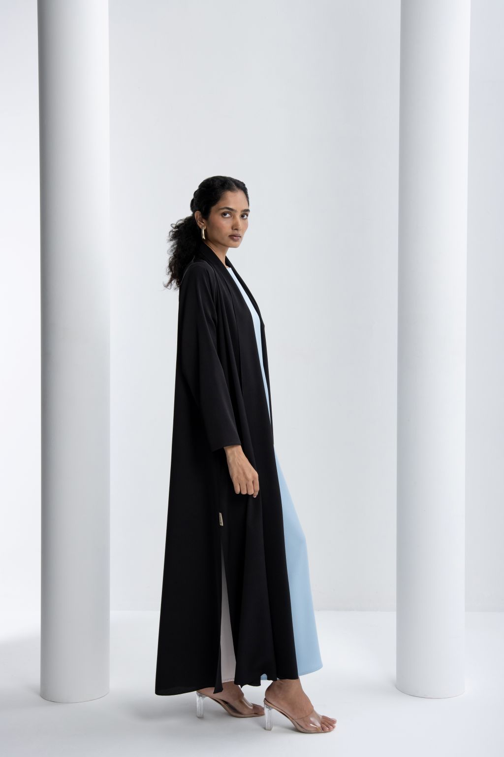 Elegant black and blue abaya featuring a flowing silhouette for stylish comfort