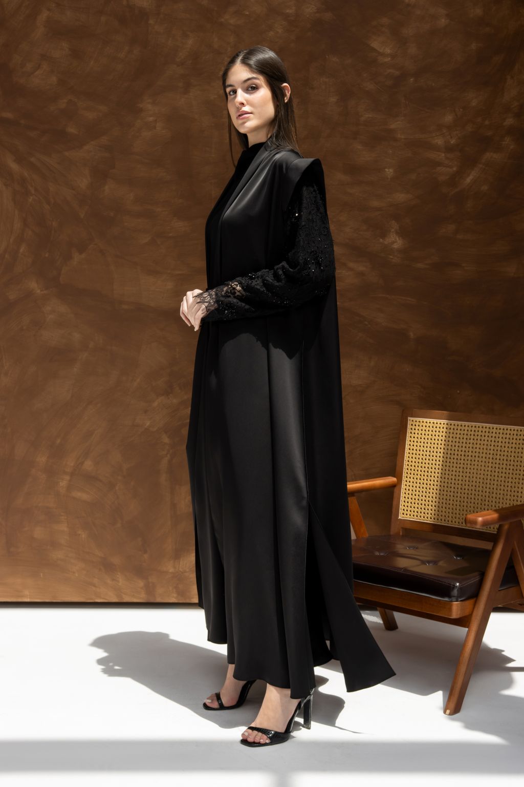 Elegant black evening dress from Selected Lines with lace sleeves and a flowing silhouette