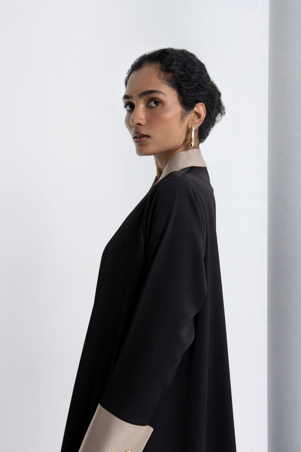 Elegant black modest abaya with contrasting cuffs for a chic and sophisticated look
