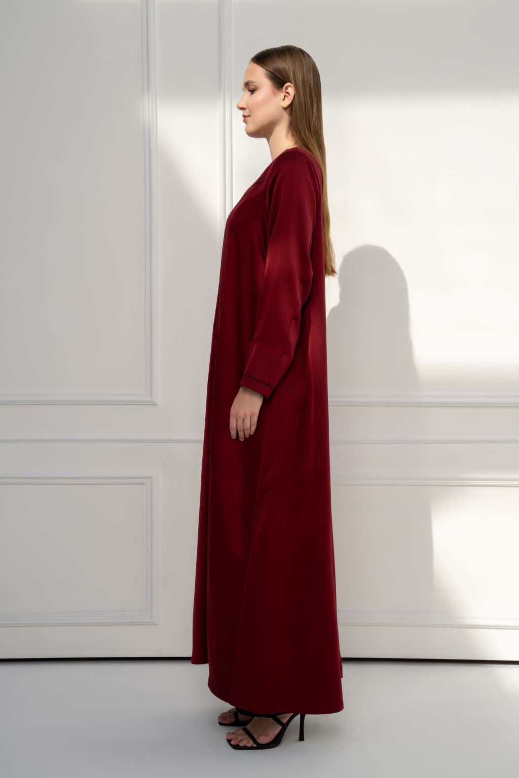 Selected Lines burgundy abaya with long sleeves, perfect for an elegant modest evening dress