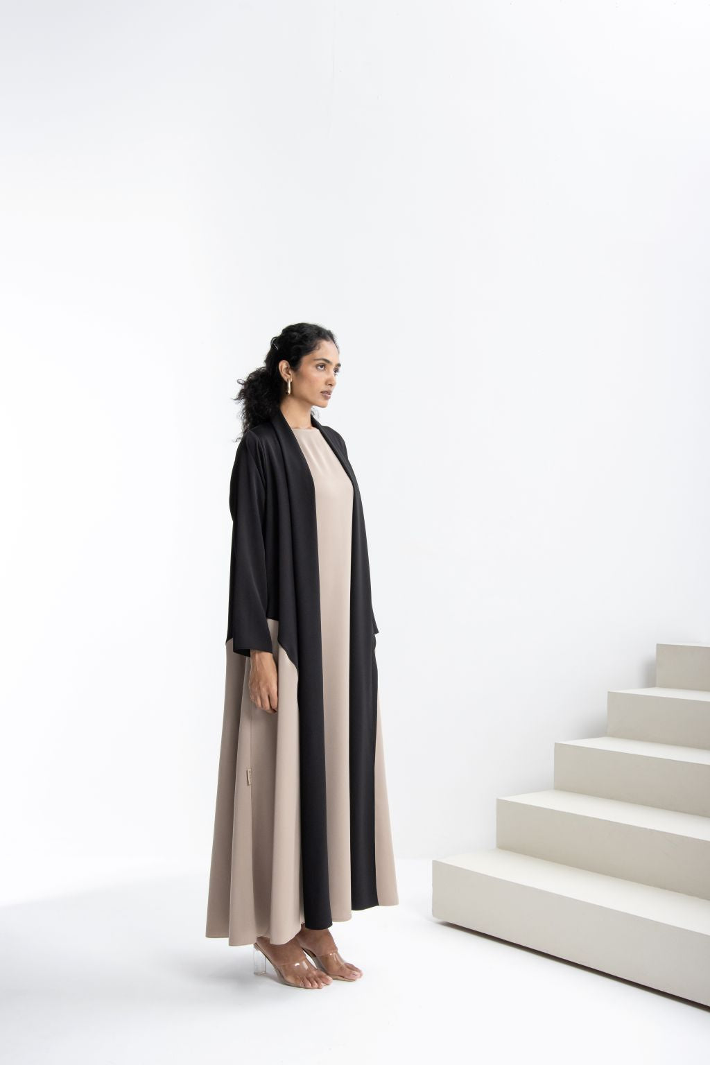 Elegant modest fashion dress featuring a sleek design in black and beige perfect for formal occasions