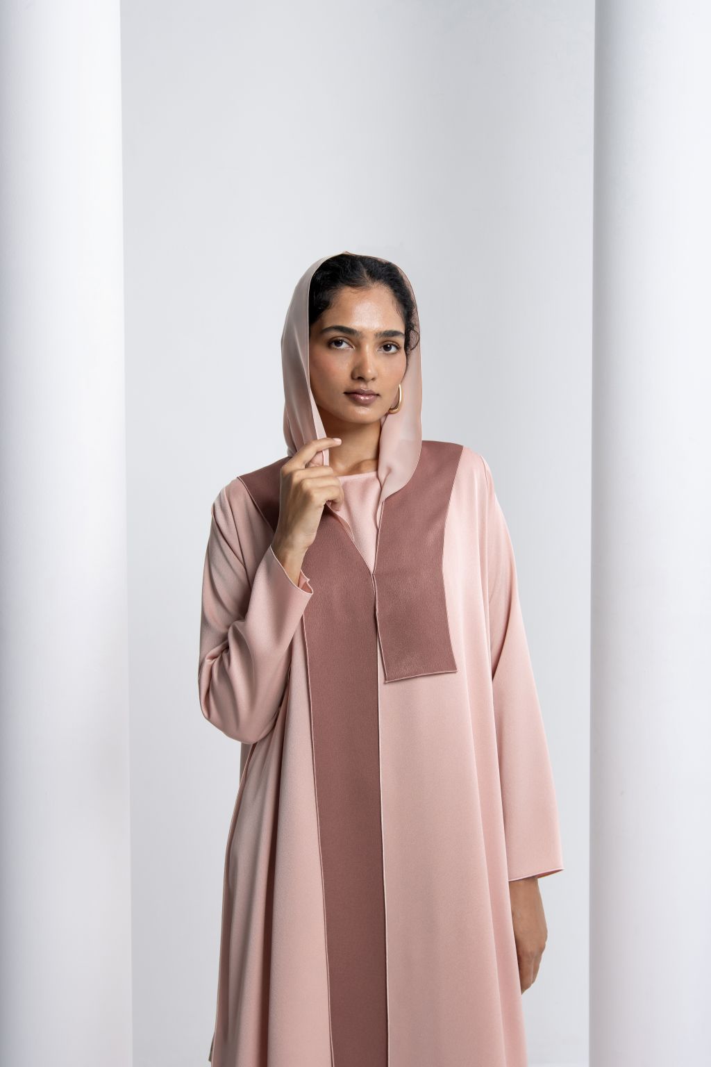 Selected Lines elegant modest fashion dress in soft pink with a stylish hood for modern elegance