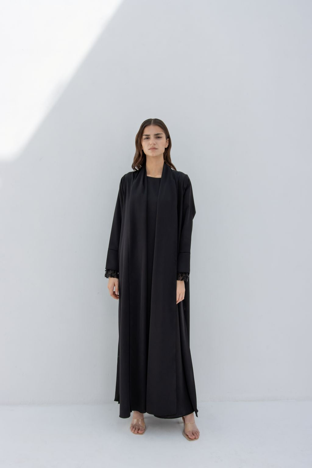 Selected Lines elegant sleeve crystals abaya in black worn by woman with long sleeves and simple design