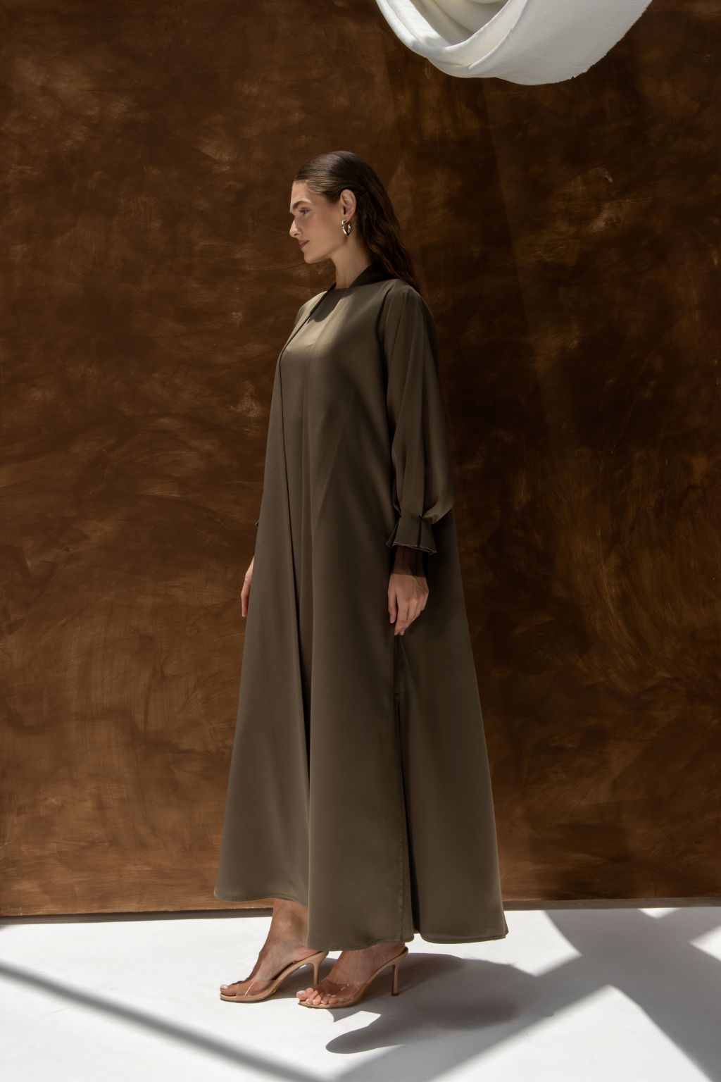 Selected Lines elegant women’s evening gown abaya in olive with long sleeves and flowing silhouette