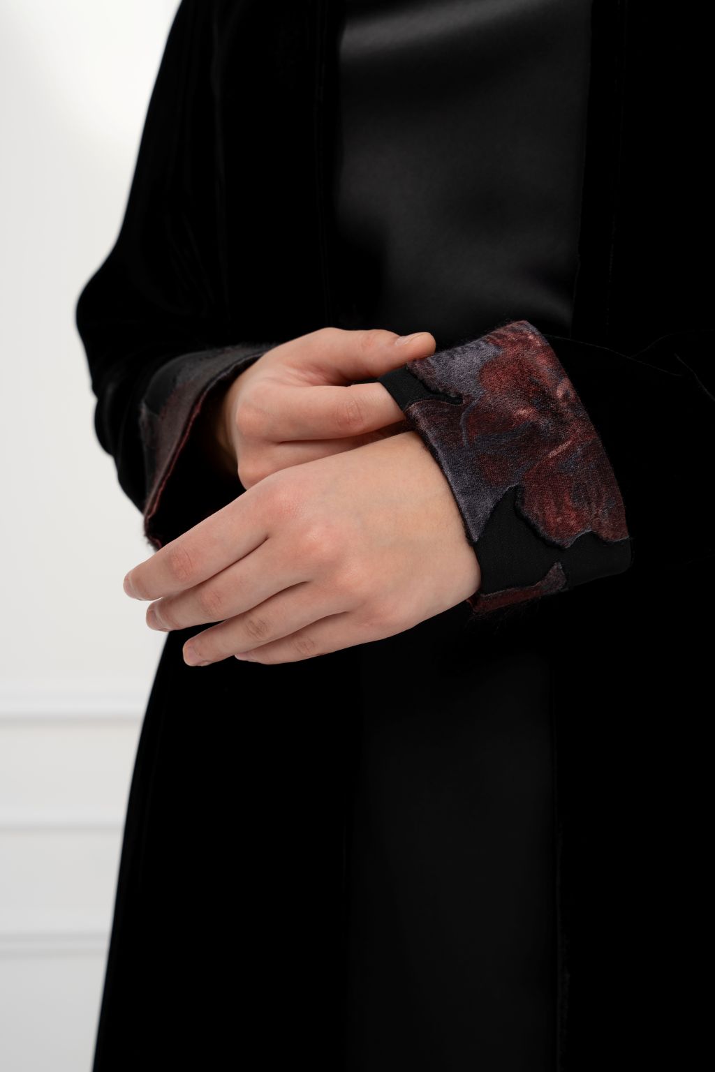 Selected Lines floral contrast abaya featuring elegant black fabric with detailed floral sleeves.