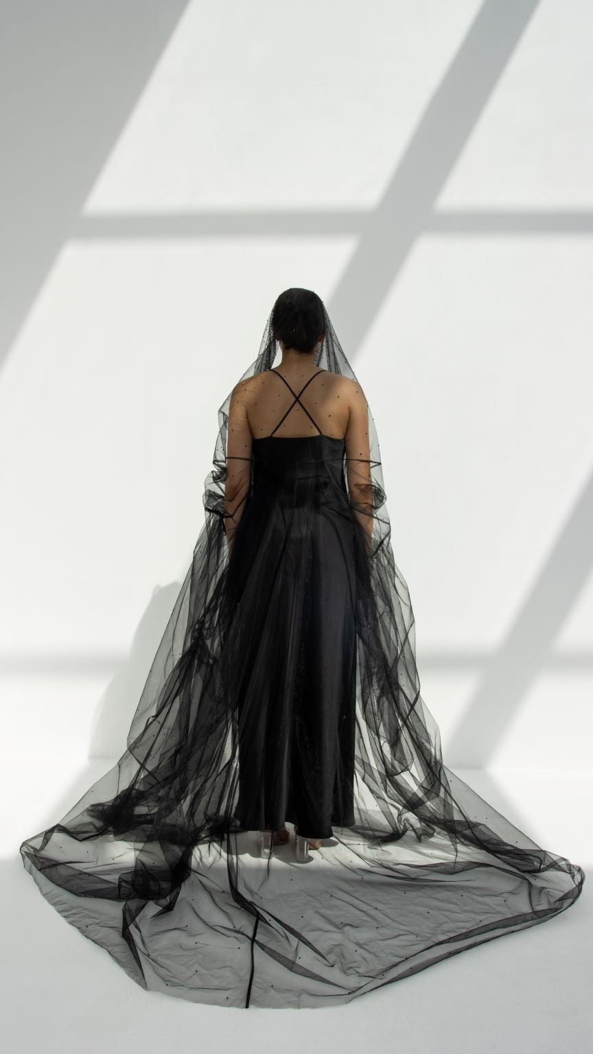 Georgina Abaya elegant design featuring a flowing sheer black veil and minimalist silhouette