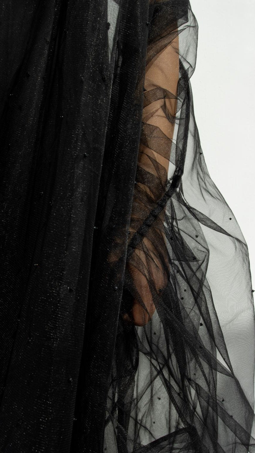 Close-up of Georgina Abaya elegant design with detailed black mesh fabric and subtle embellishments