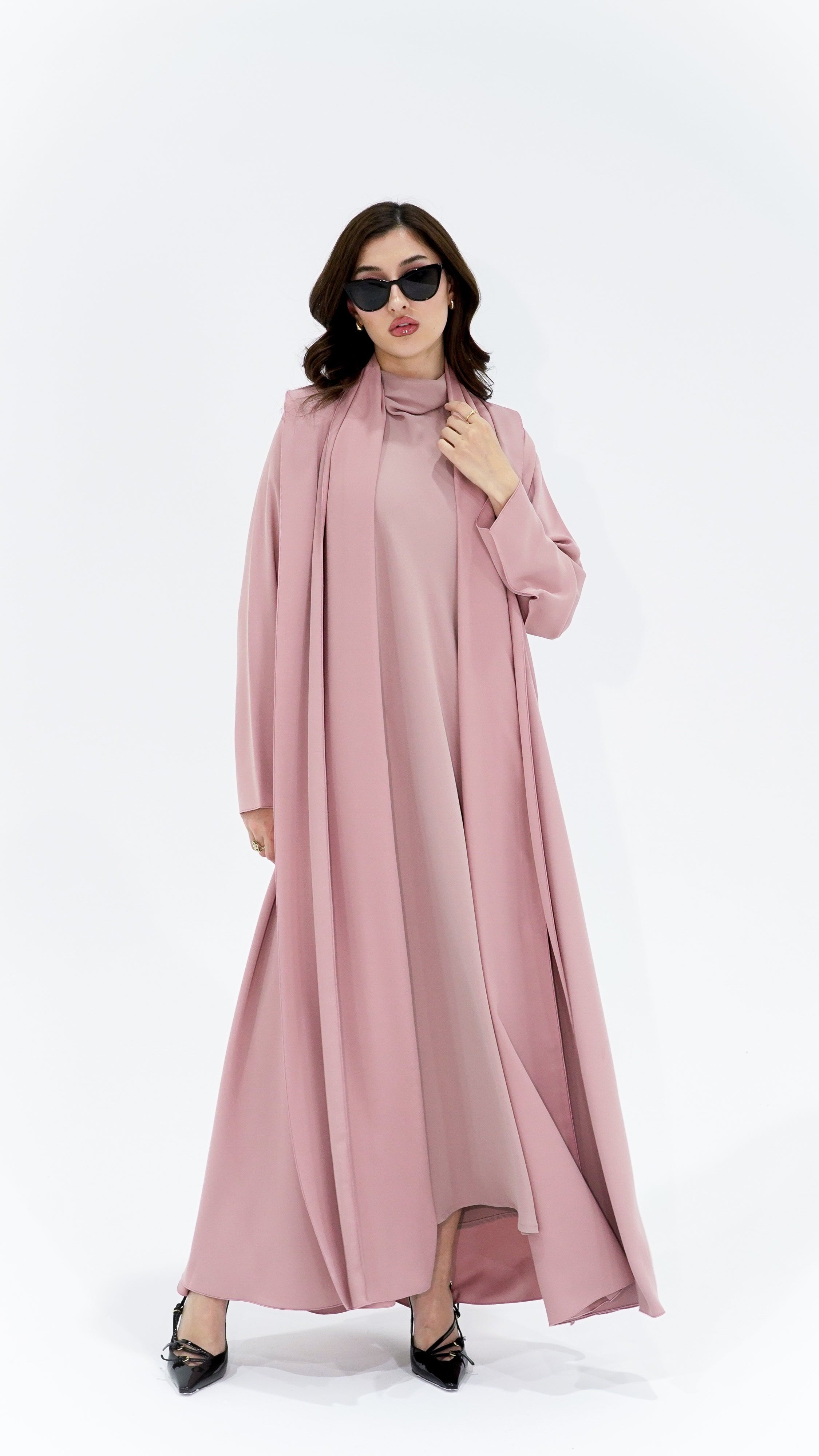 Elegant high quality Arabic abaya in soft pink with stylish draped design and long sleeves