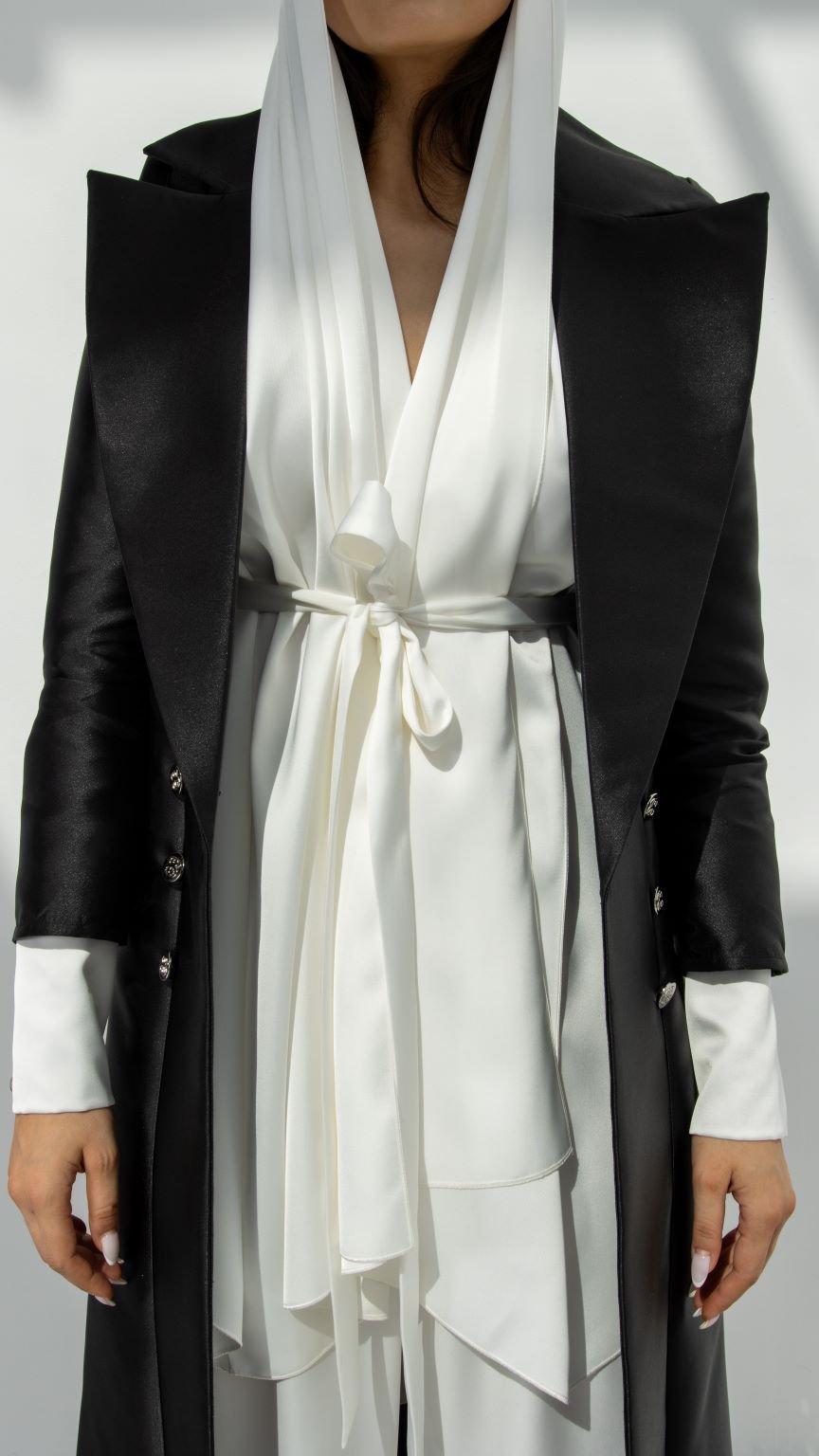 Elegant luxury black abaya for women with a stylish white satin overlay and tie waist detail