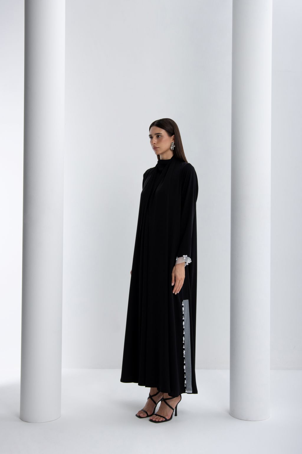 Elegant luxury black abaya for women featuring a modern silhouette and unique embellishments
