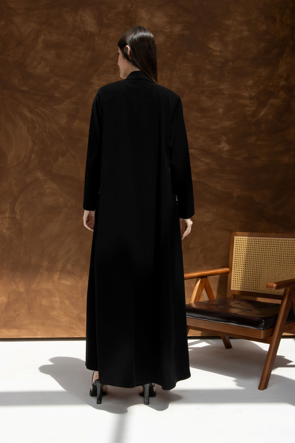 Back view of a luxury black abaya with hidden pockets, designed for elegance and comfort.