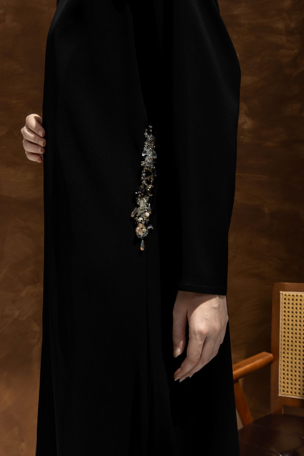 Elegant luxury black abaya with hidden pockets and stylish embellishments on the side