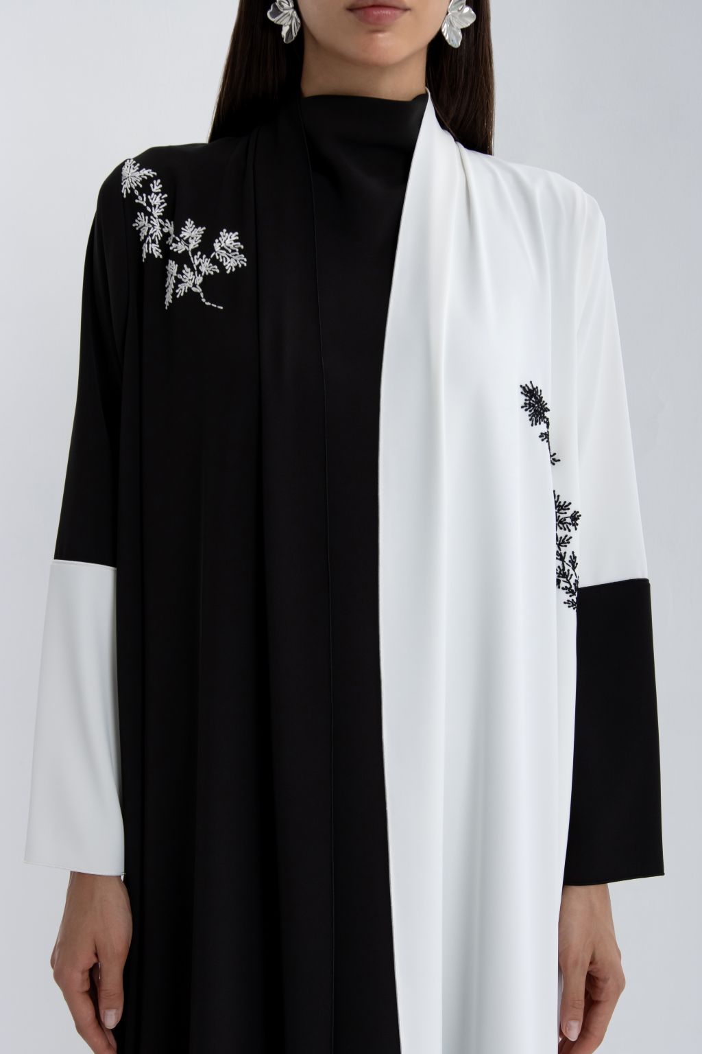 Luxury black and white abaya with stylish floral embroidery for elegant occasions