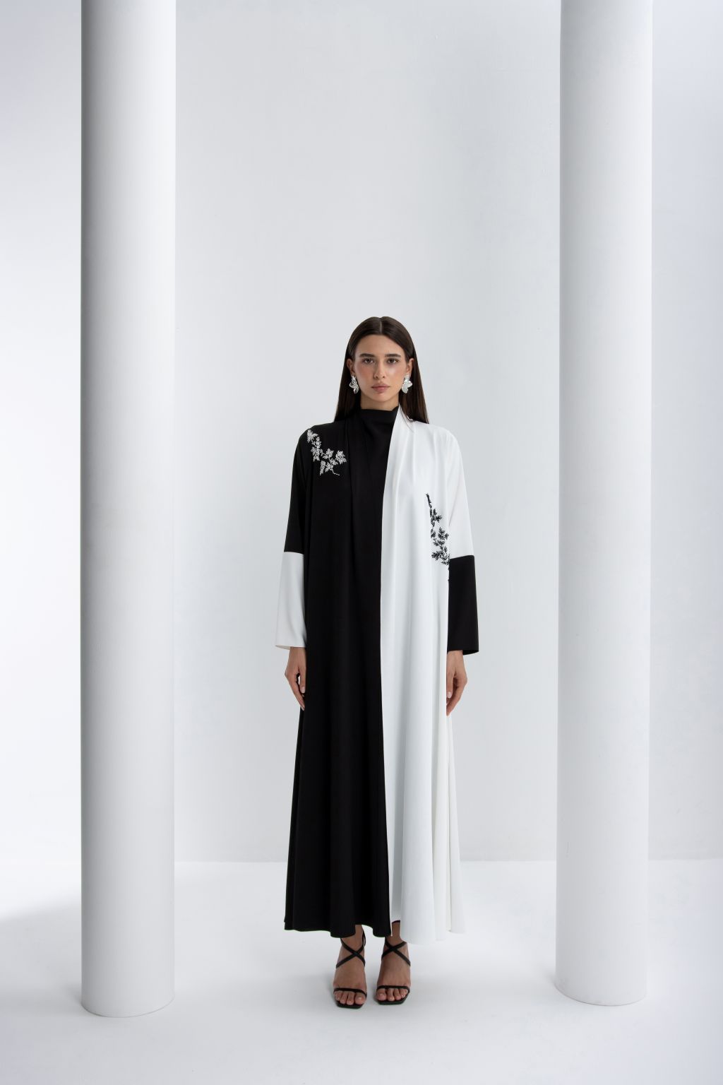 Luxury black and white abaya with floral embroidery and elegant design for a chic look