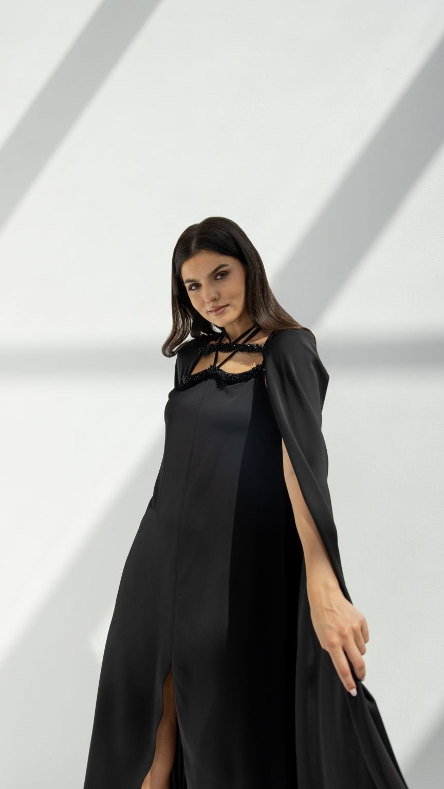 Selected Lines luxury cape chain abaya in black featuring cape sleeves and chain neckline detail