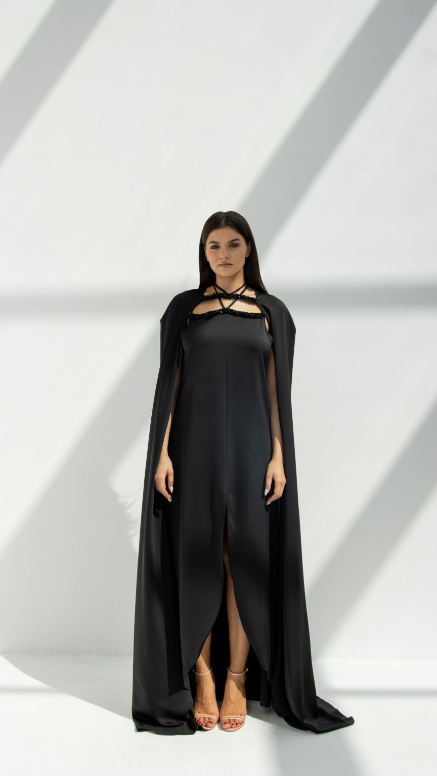 Selected Lines black luxury cape chain abaya with front slit and strappy neckline on model