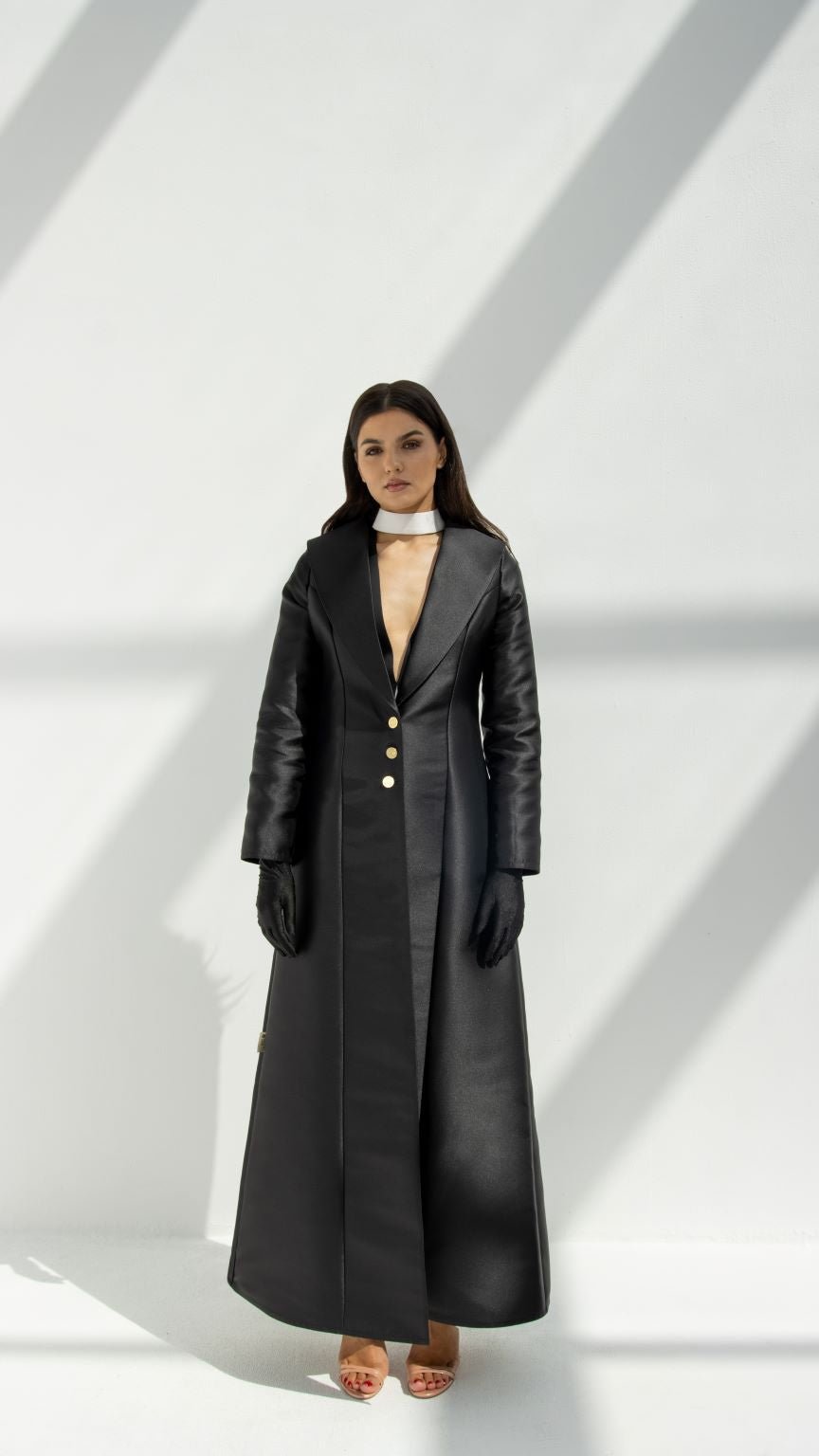 Selected Lines black luxury coat abaya with gold buttons and quilted sleeves worn with black gloves