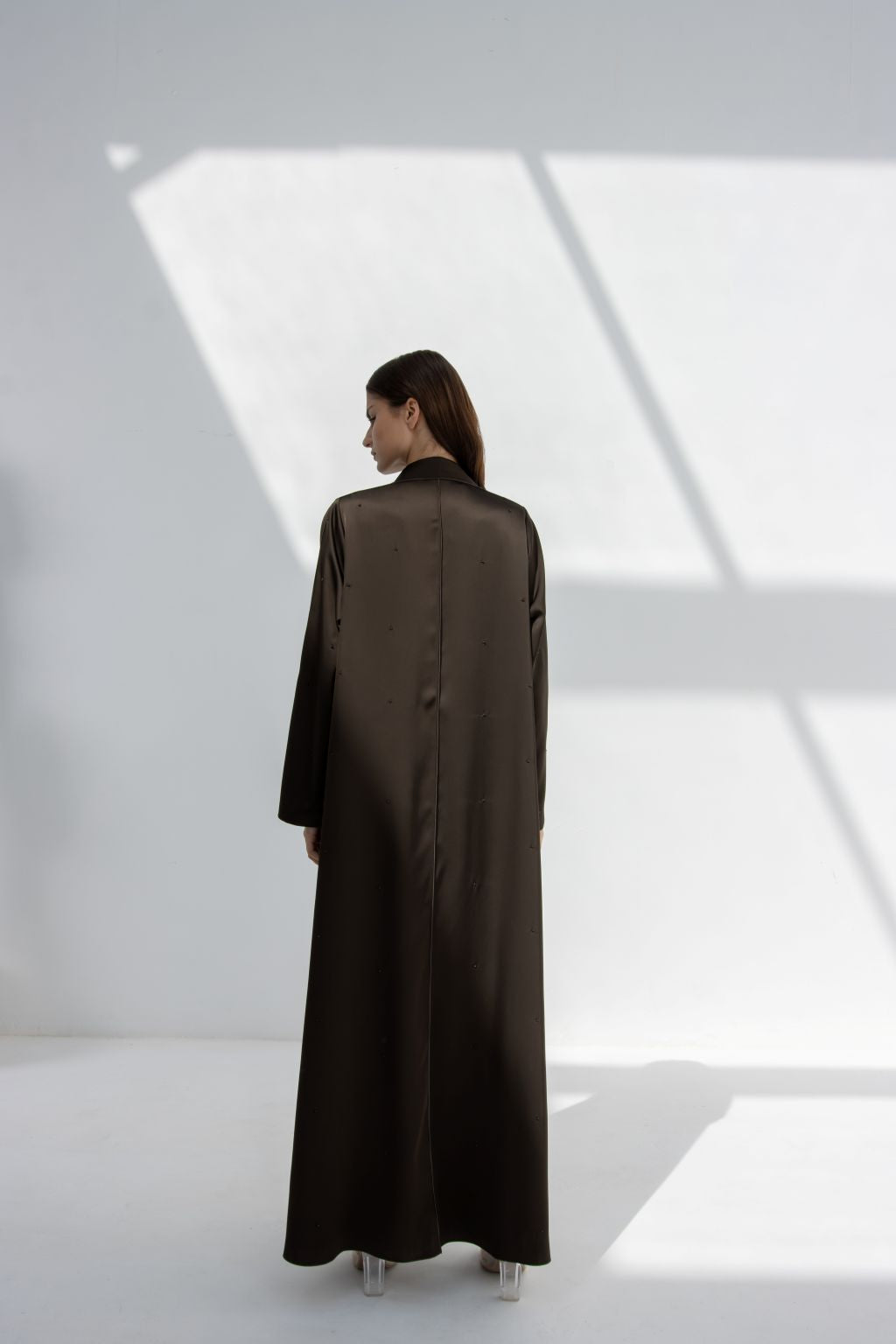 Selected Lines luxury evening stone abaya in dark color with full back view on model