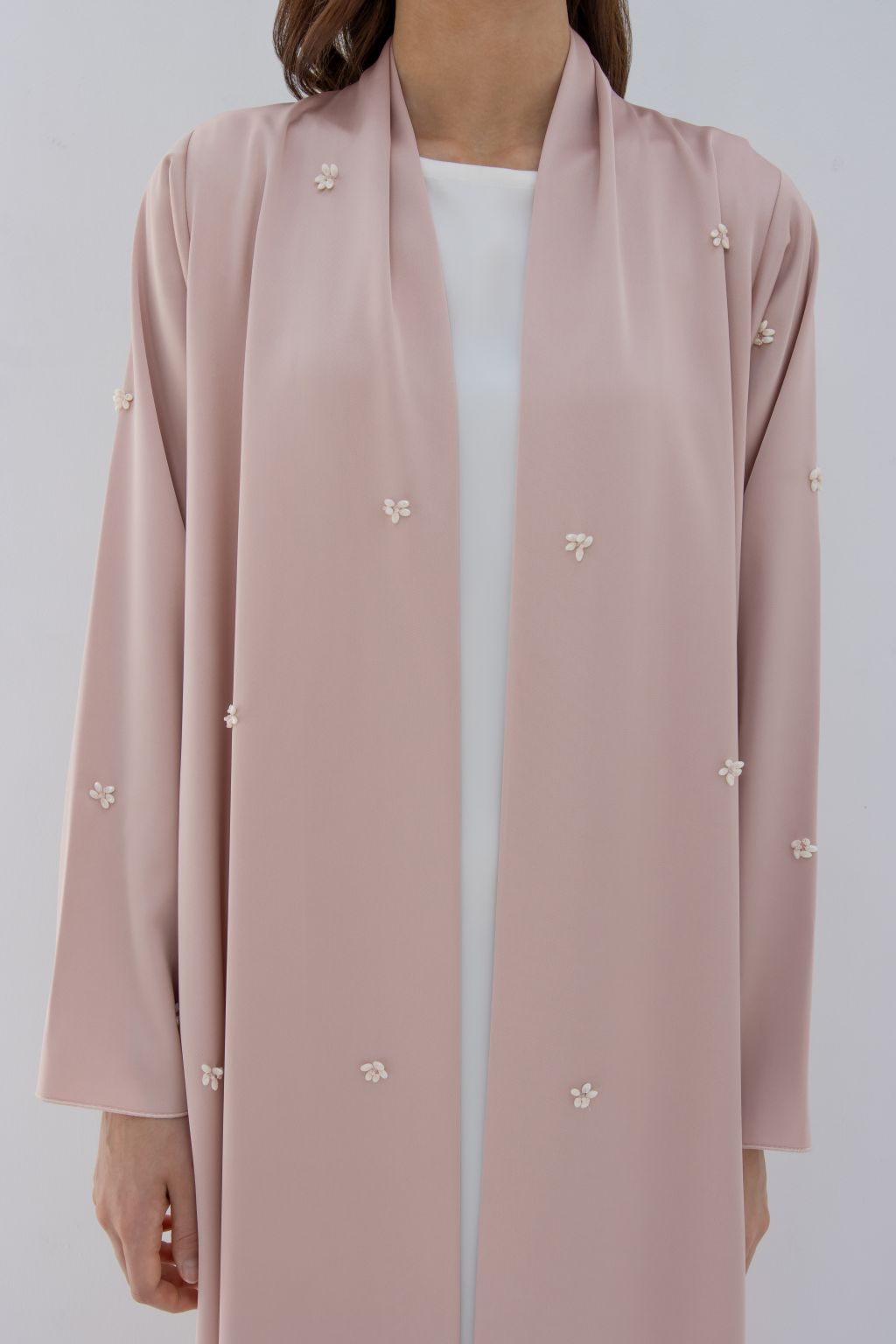 Selected Lines luxury fashion abaya in blush pink with delicate pearl embellishments on sleeves and front