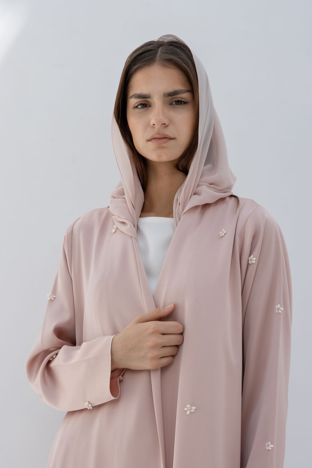 Selected Lines luxury fashion abaya in soft pink with delicate pearl embellishments and hooded design