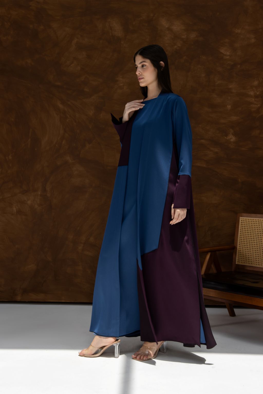 Selected Lines luxury HueLine blue abaya with contrasting dark purple accents worn by model