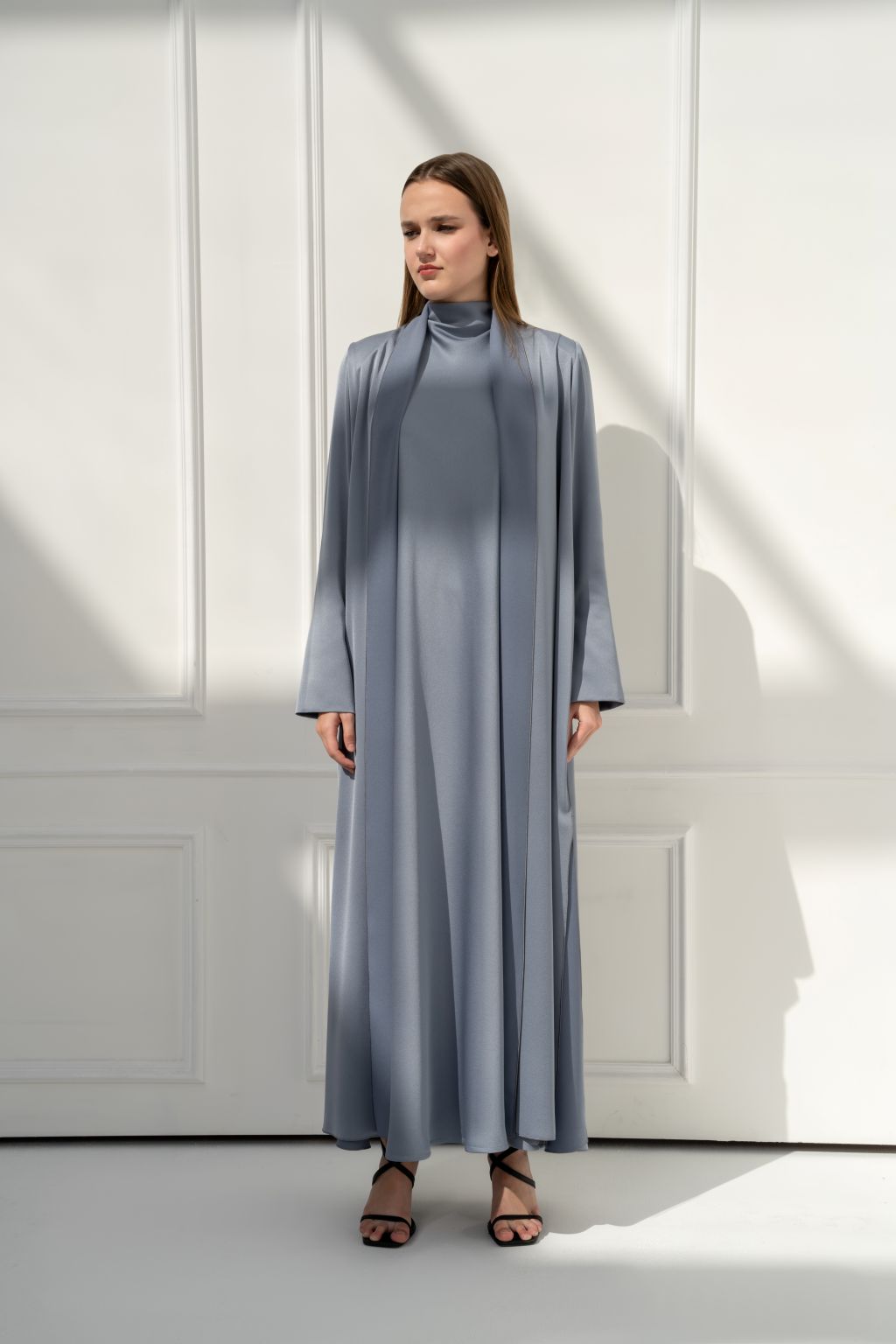 Selected Lines luxury modest dress for women in light gray, featuring a flowing design and high neckline