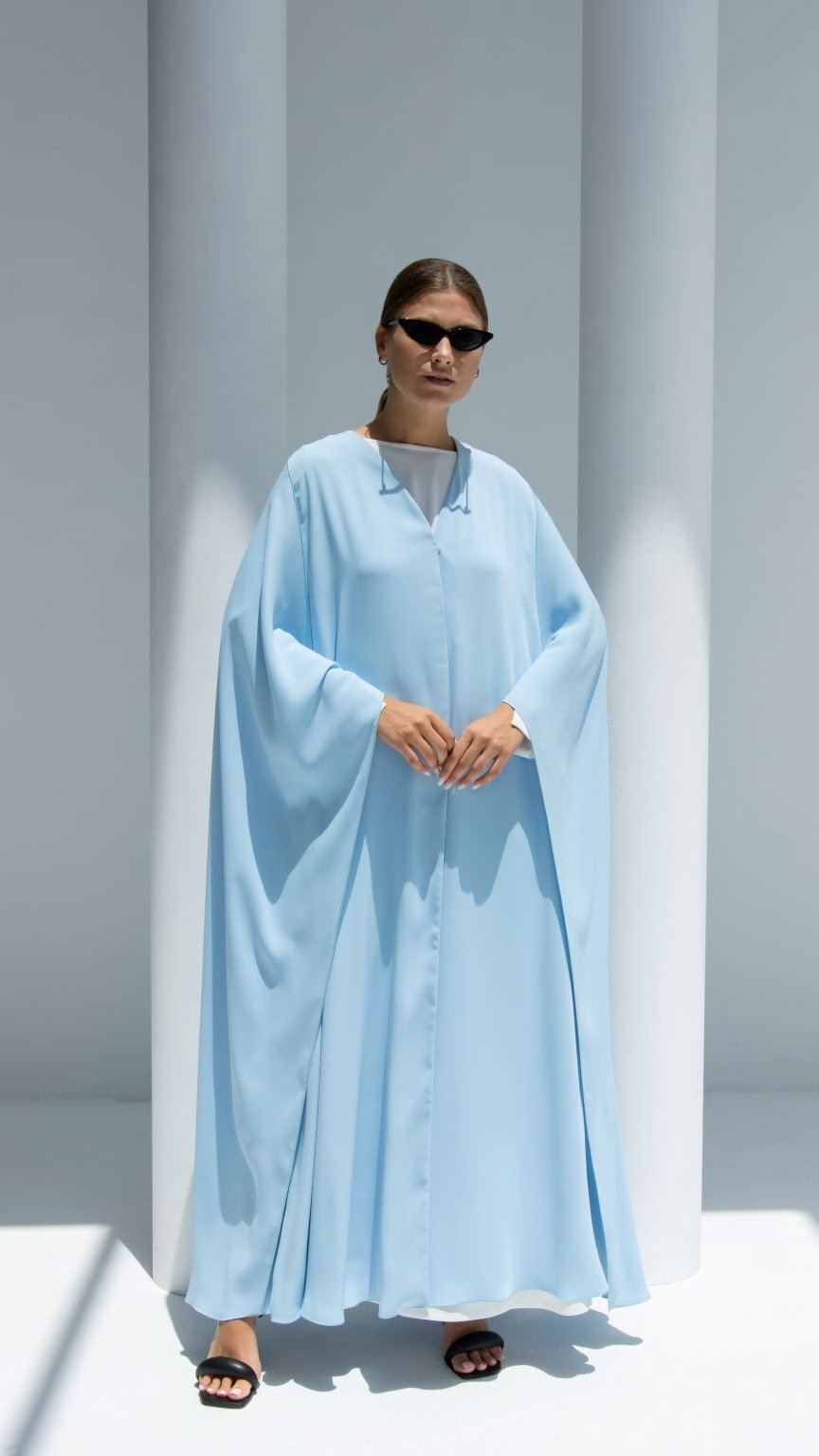 Elegant luxury Noura Abaya in light blue with flowing sleeves and a relaxed fit