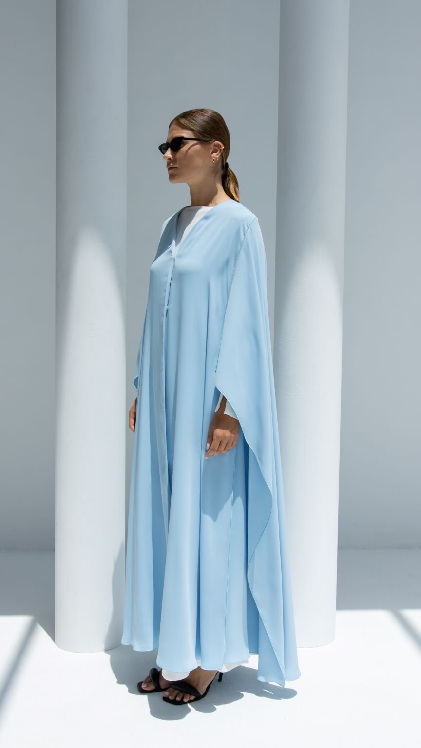 Elegant luxury Noura Abaya in soft blue with flowy silhouette and open sleeves