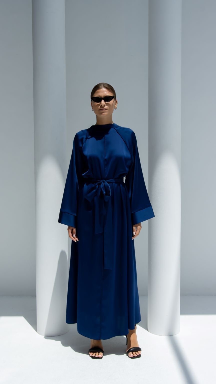 Elegant luxury silk belt dress in deep navy featuring long sleeves and a flattering tie waist