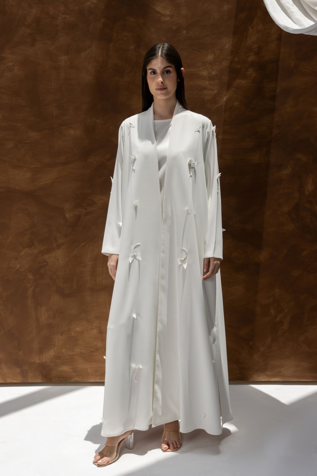 Selected Lines luxury white abaya dress with long sleeves and delicate bow detailing