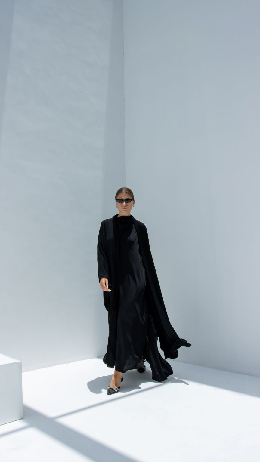 Stylish Mermaid Stich Abaya in black, flowing silhouette ideal for elegant occasions