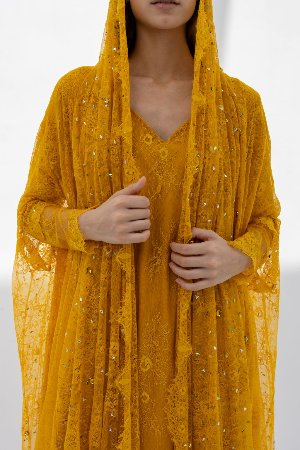 Close-up of mustard dantel fabric used in Munera Abaya | Selected Lines