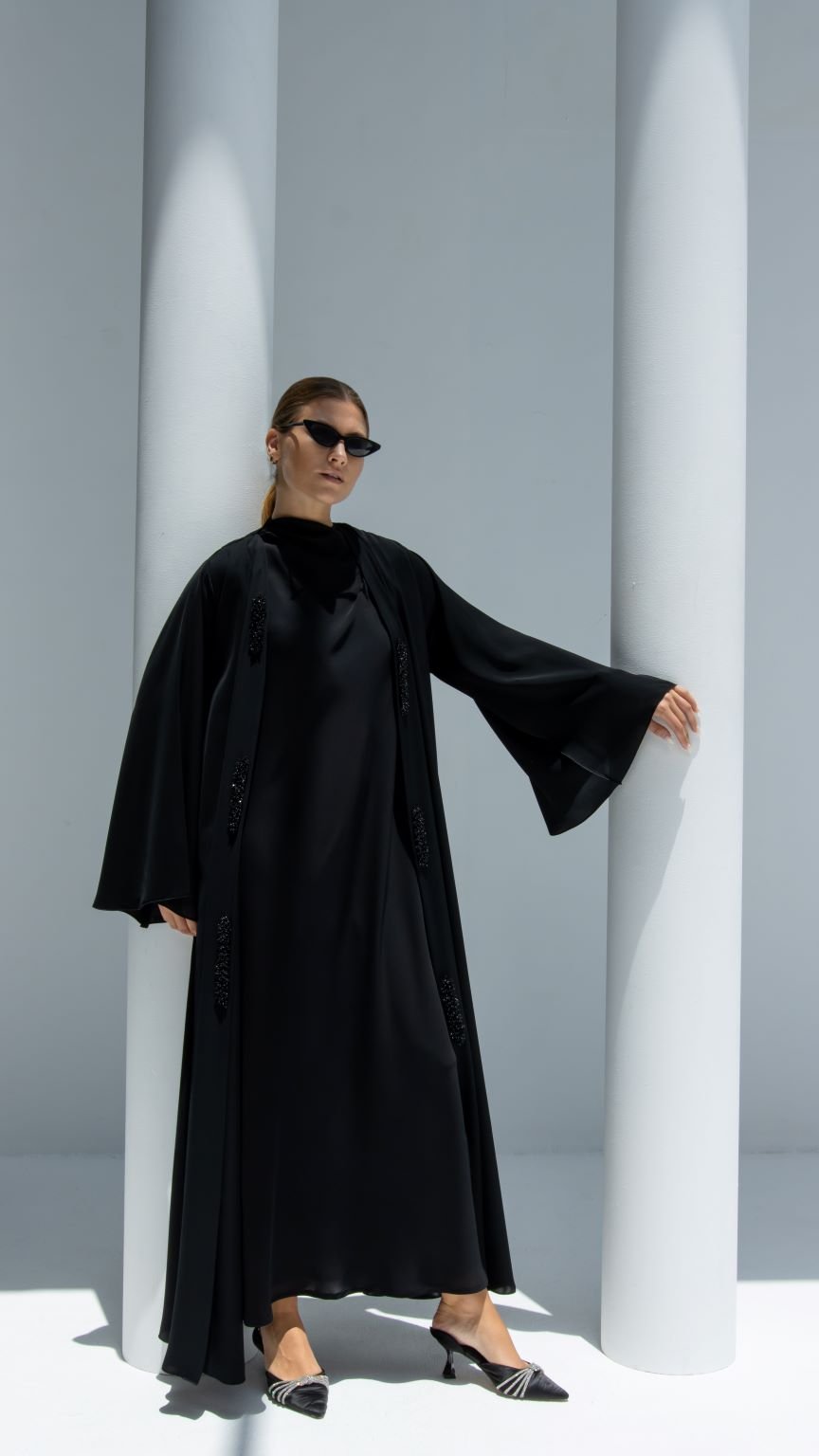 Side profile of Pop-up Abaya highlighting Franci sleeves and fluent black design | Selected Lines