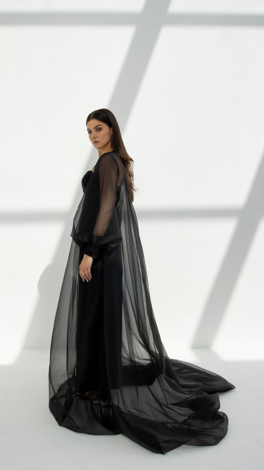 Side profile of Puff Occasional Abaya highlighting non-stretchy black organza fabric and sparkling embellishments | Selected Lines