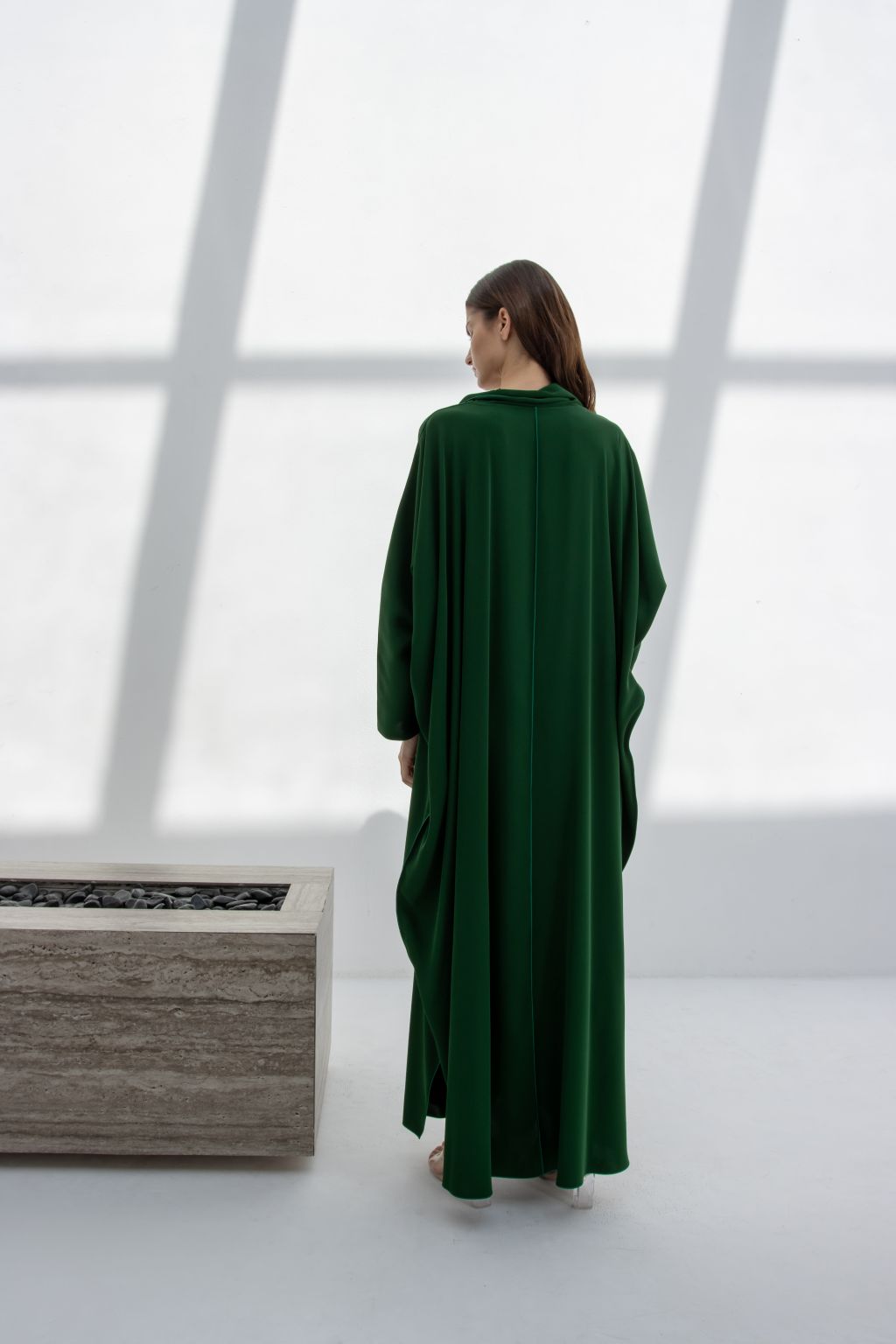 Selected Lines Radaman Dress 2025 in green, showcasing a flowing inner dress from the back